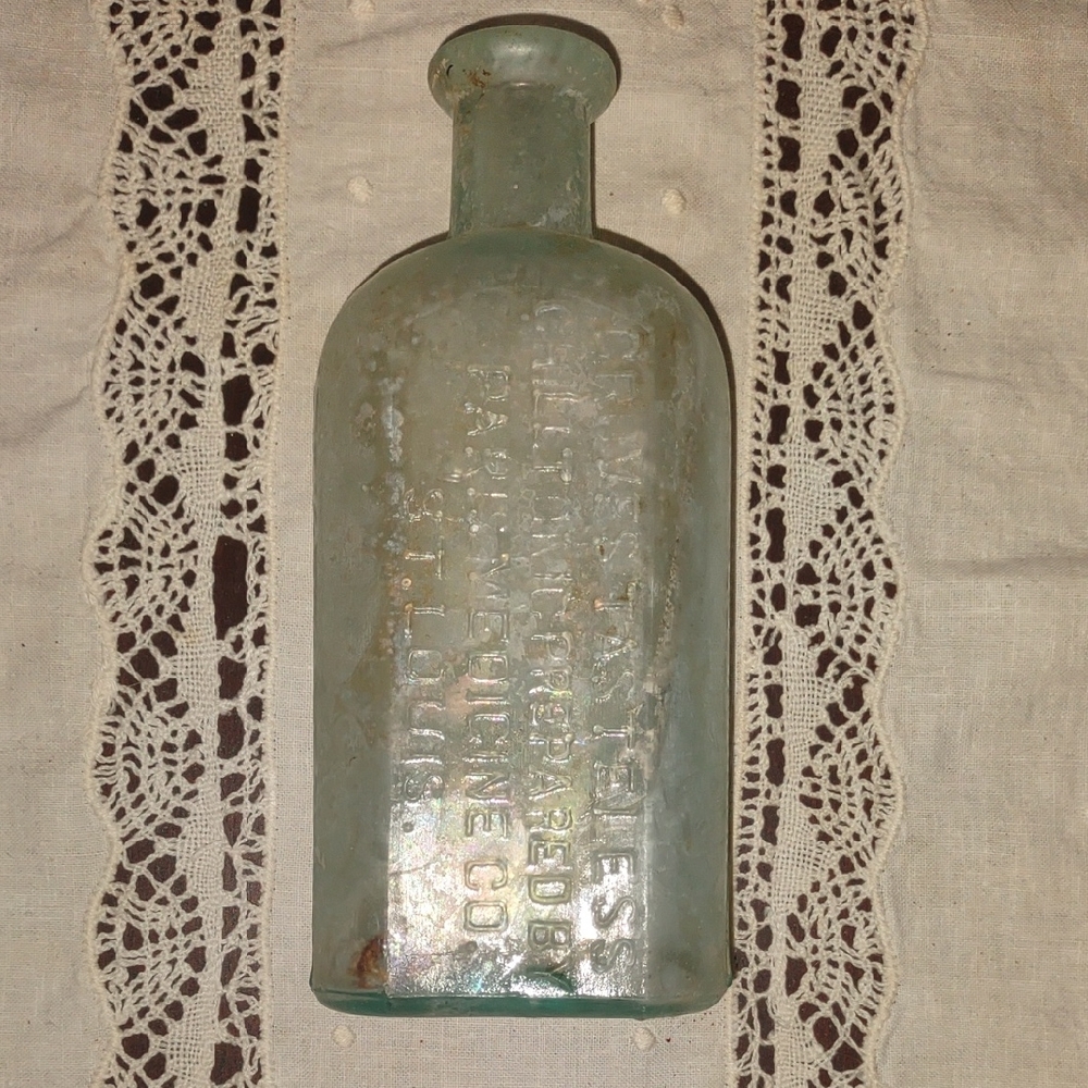 Vintage Embossed Glass Bottle